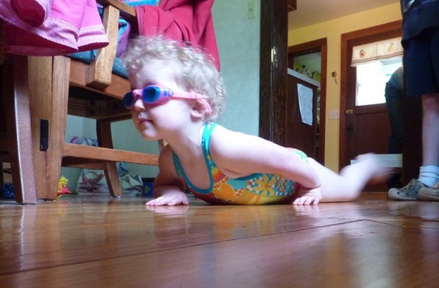 Bethany doing swimming lessons in the dining room.