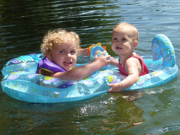 beth lydia Bethany and Lydia floating happily in the chilly lake.