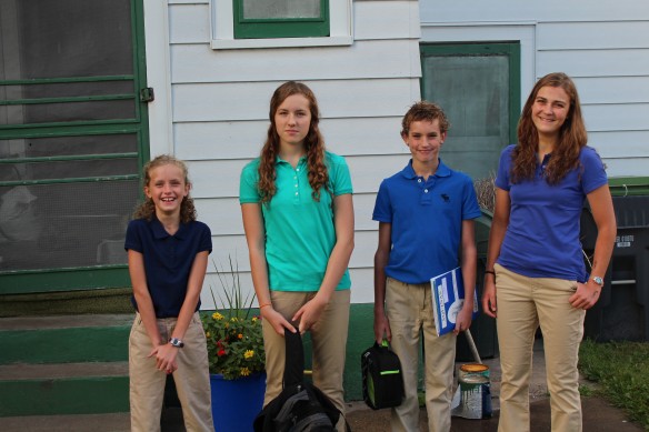 Four kids on the first day of school. Claire looks grumpy