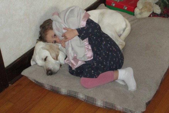 Lydia laying on Jack the dog